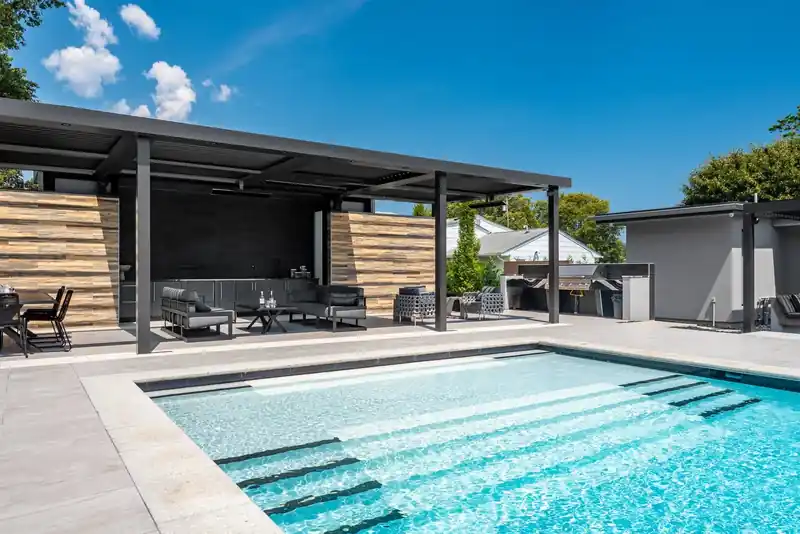 Pool with a timber pavilion along one side